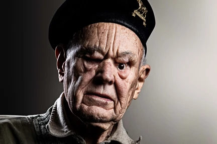 Blind veteran Mike wearing his military beret and medals