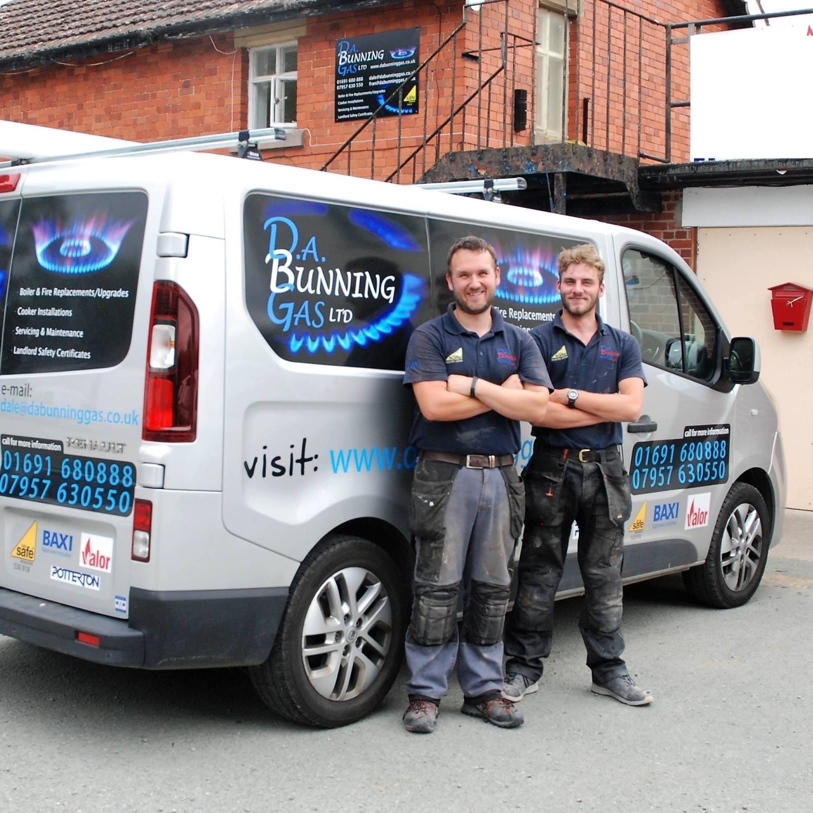 Charity supporter Dale and his colleague, standing in front of their work van, smiling.
