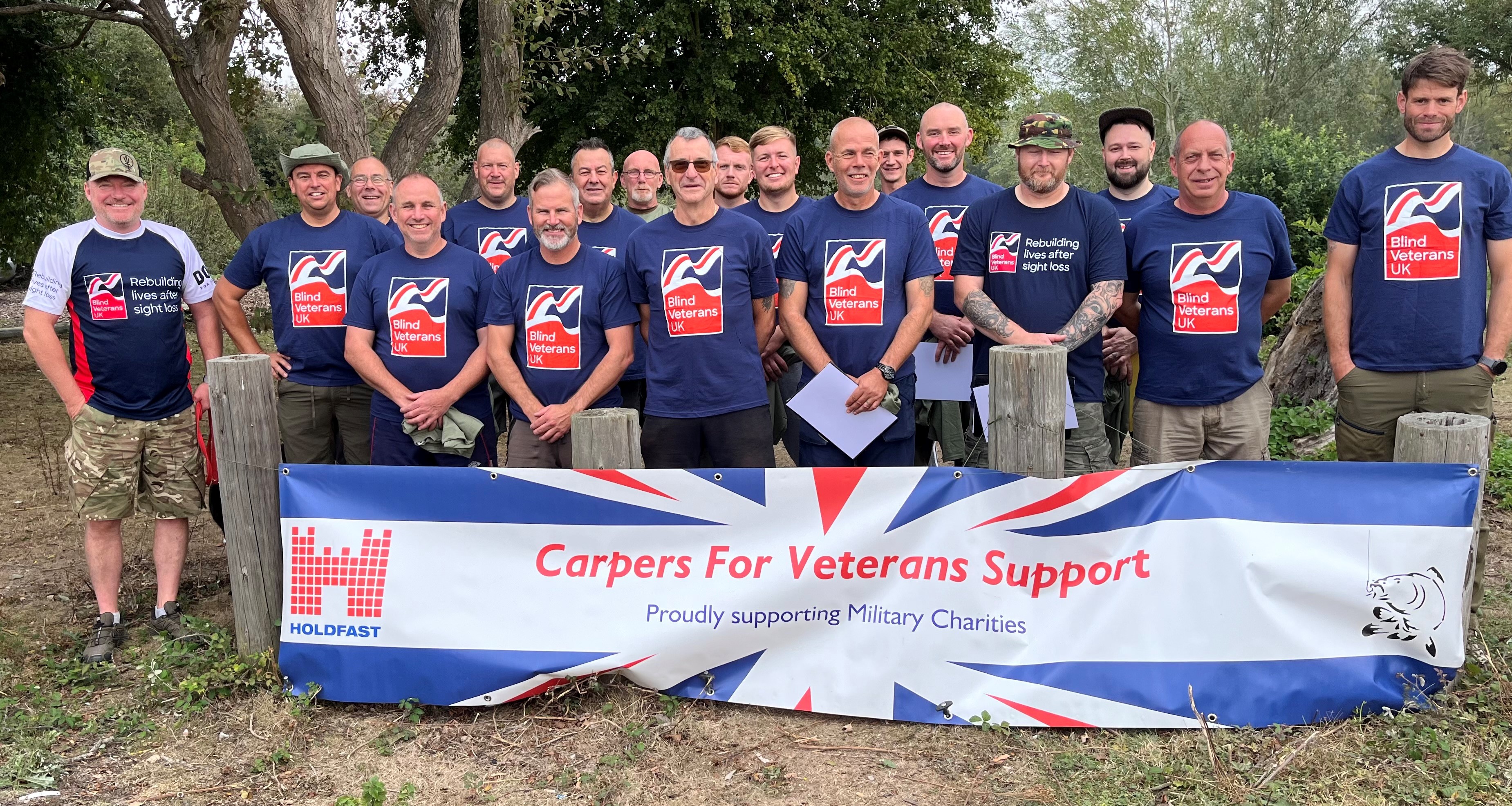 Group photograph of the Carpers for Veterans Support team and competitors all wearing their Blind Veterans UK t-shirts