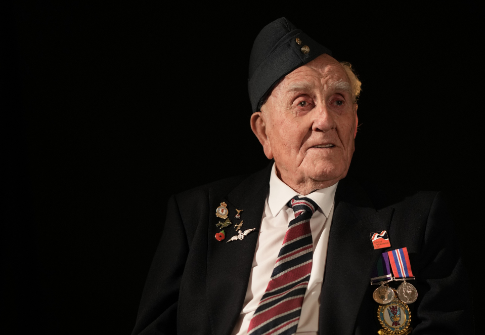 Blind veteran Michael in a suit with his medals