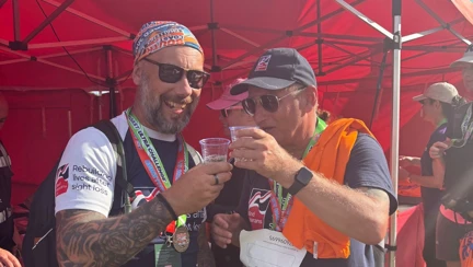 Lee and Aaron with a glass of prosecco