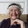 A photo of an elderly woman smiling