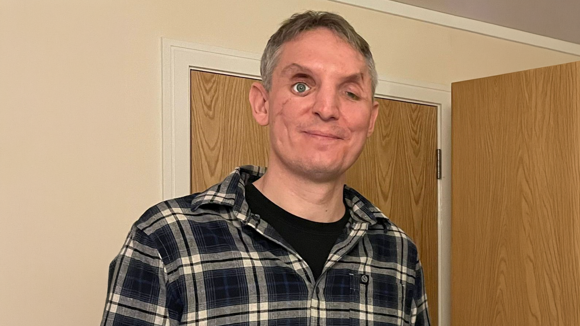 Ben stood smiling 