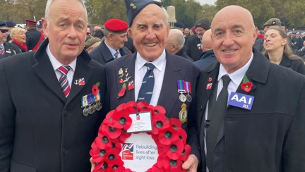 Our CEO Adrian Bell, Member Michael Woods holding our wreath and his son Eddie