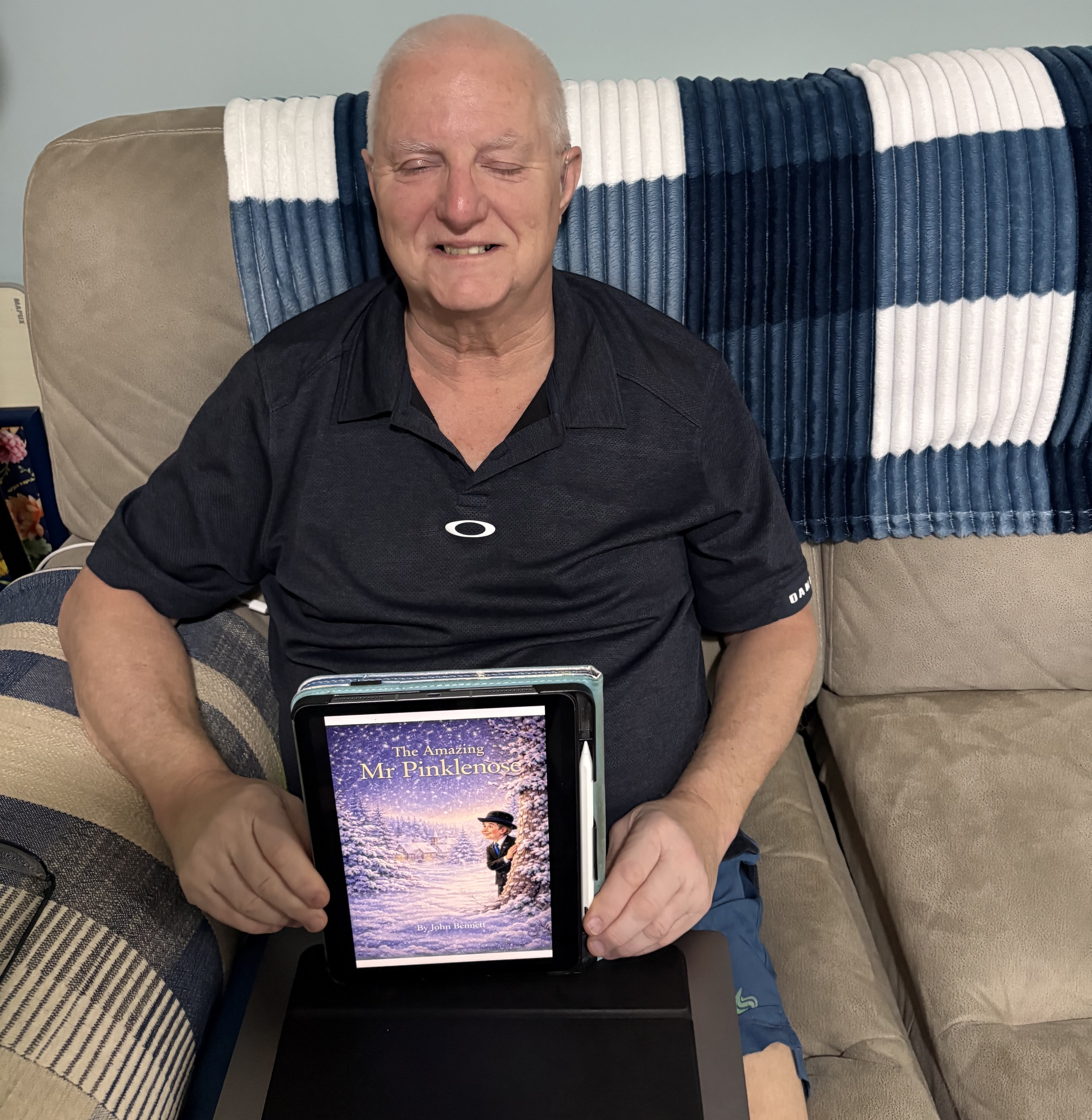 Blind veteran John sitting on the sofa with his eyelids closed due to myasthenia gravis