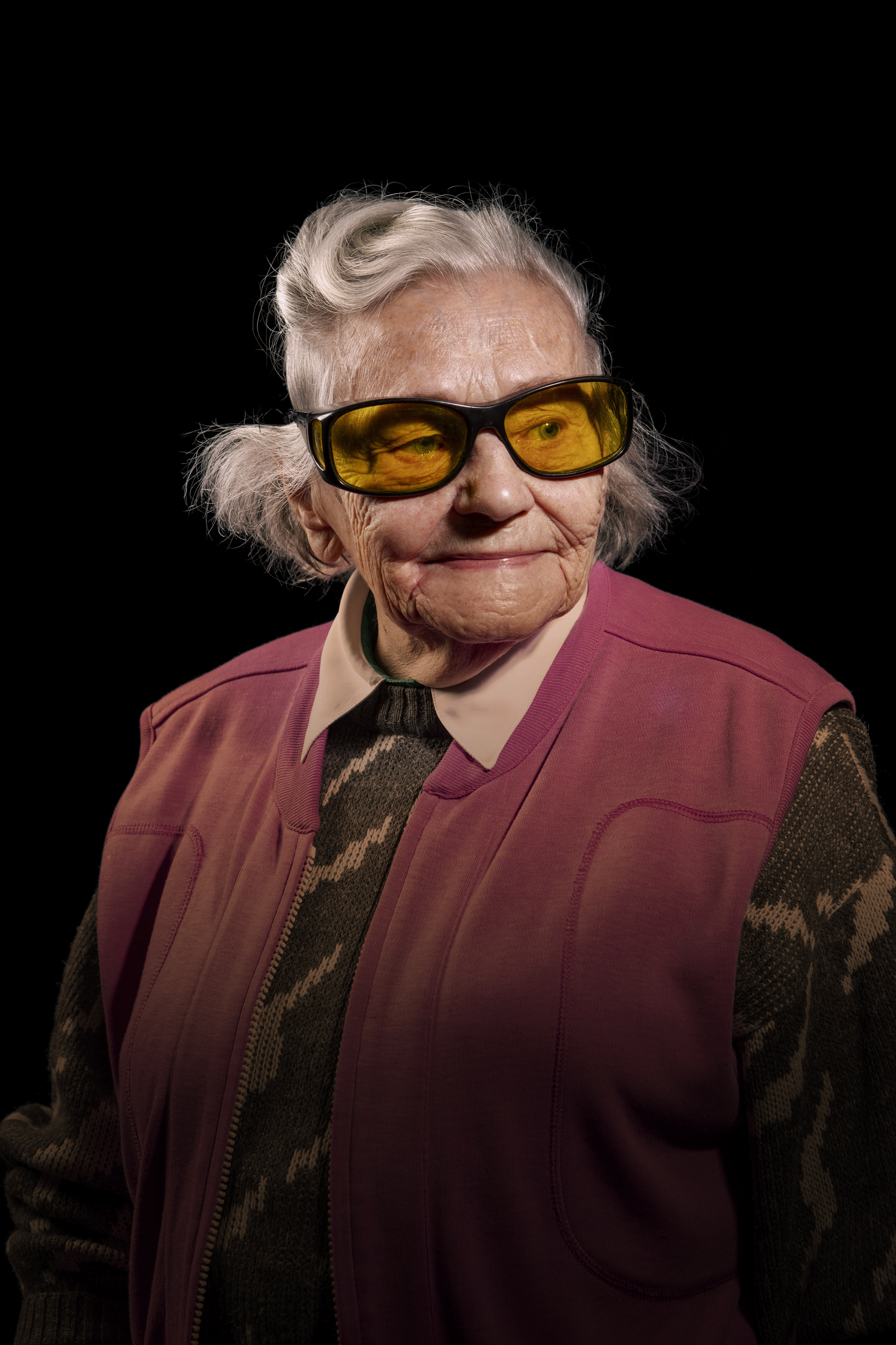 A portrait of Neena on a black background