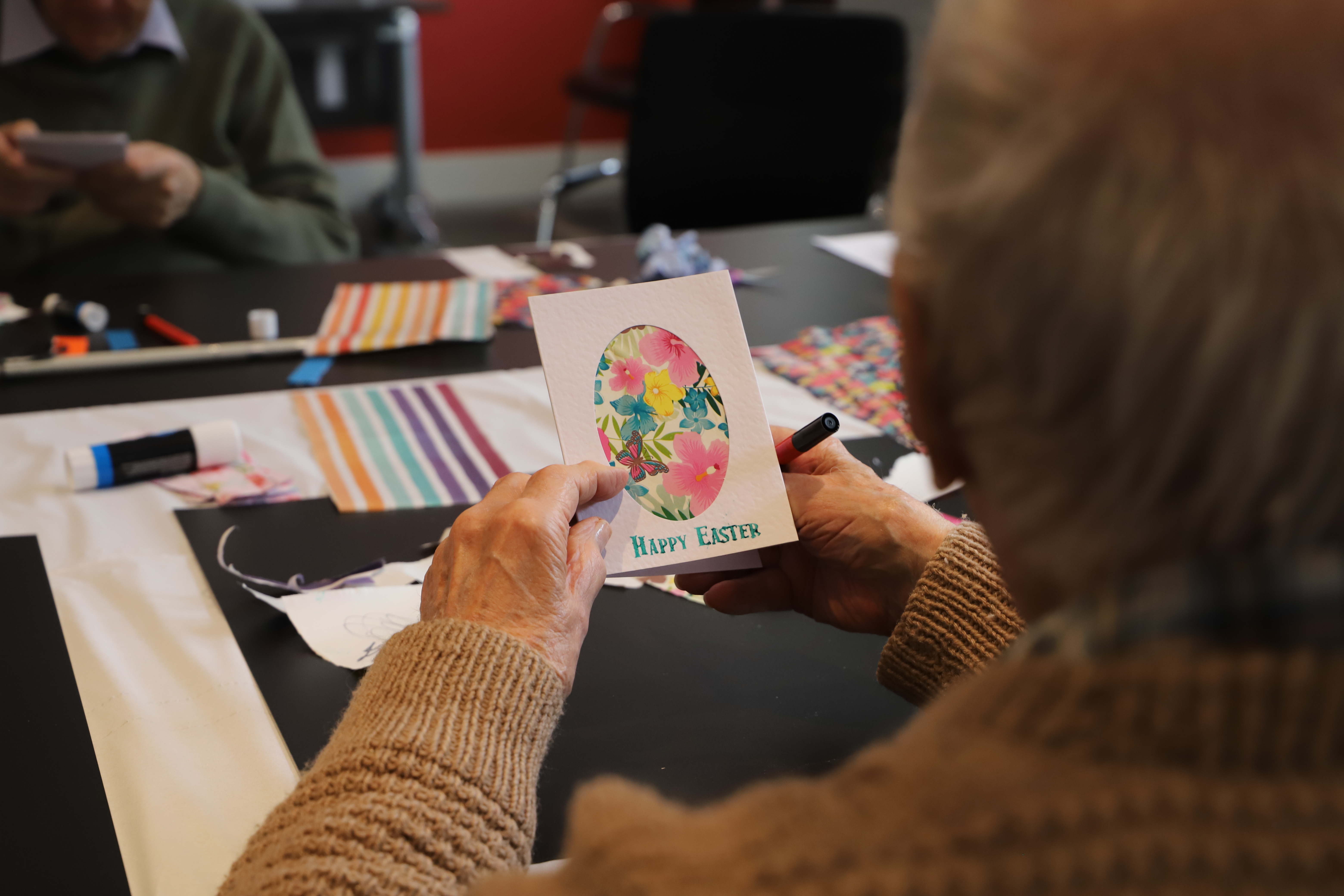 Easter themed activity day for members with a card saying 'Happy Easter'