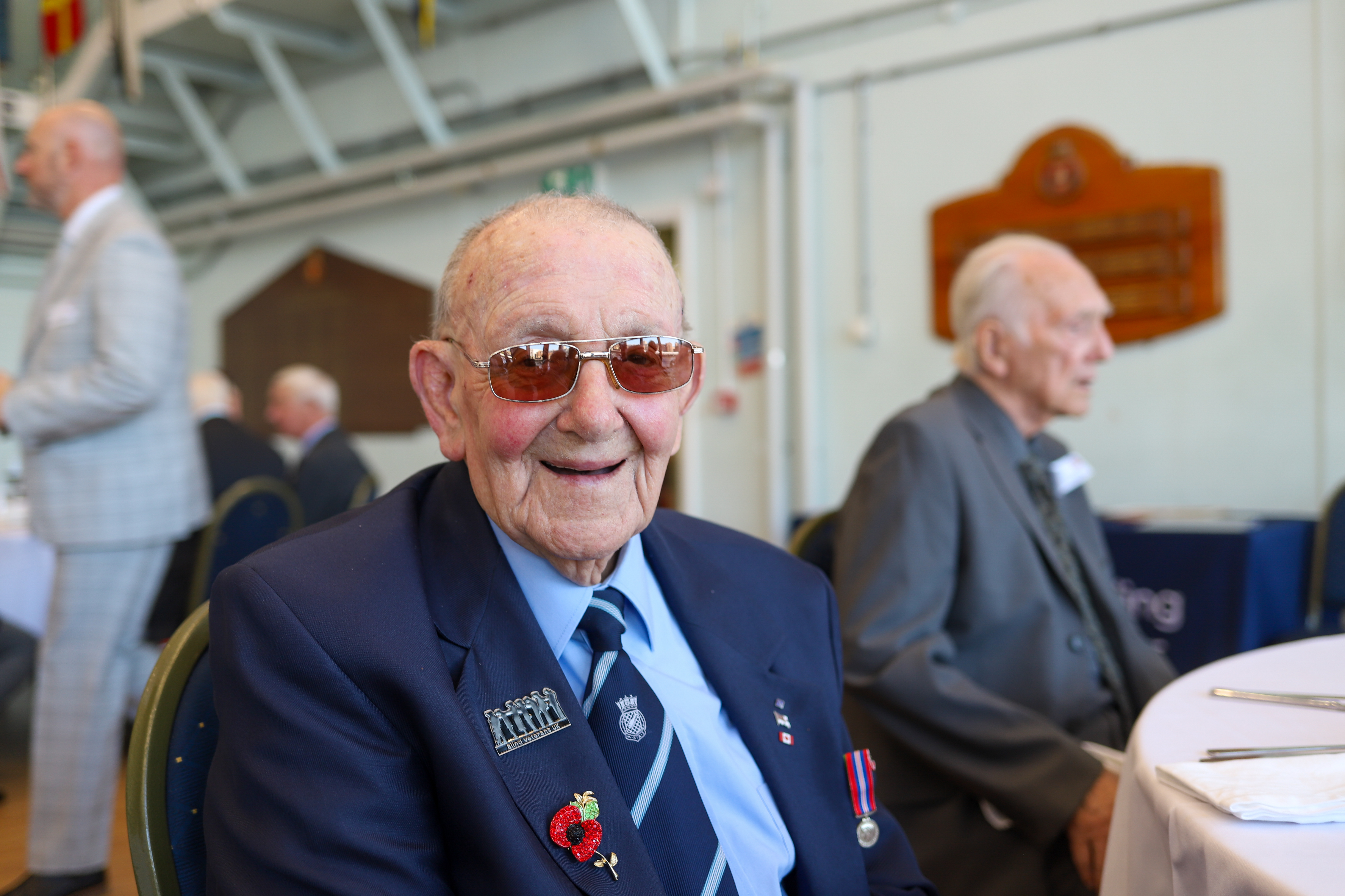 Second World War veteran Kenneth sat smiling at his dinner table.
