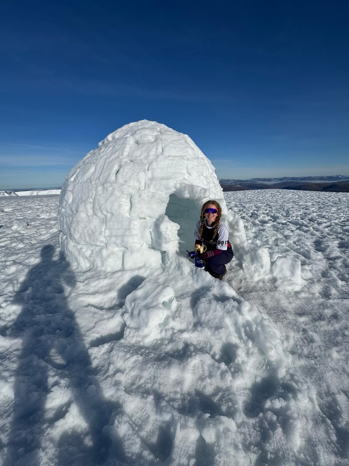 Anna poses inside an igloo at Ben Nevis
