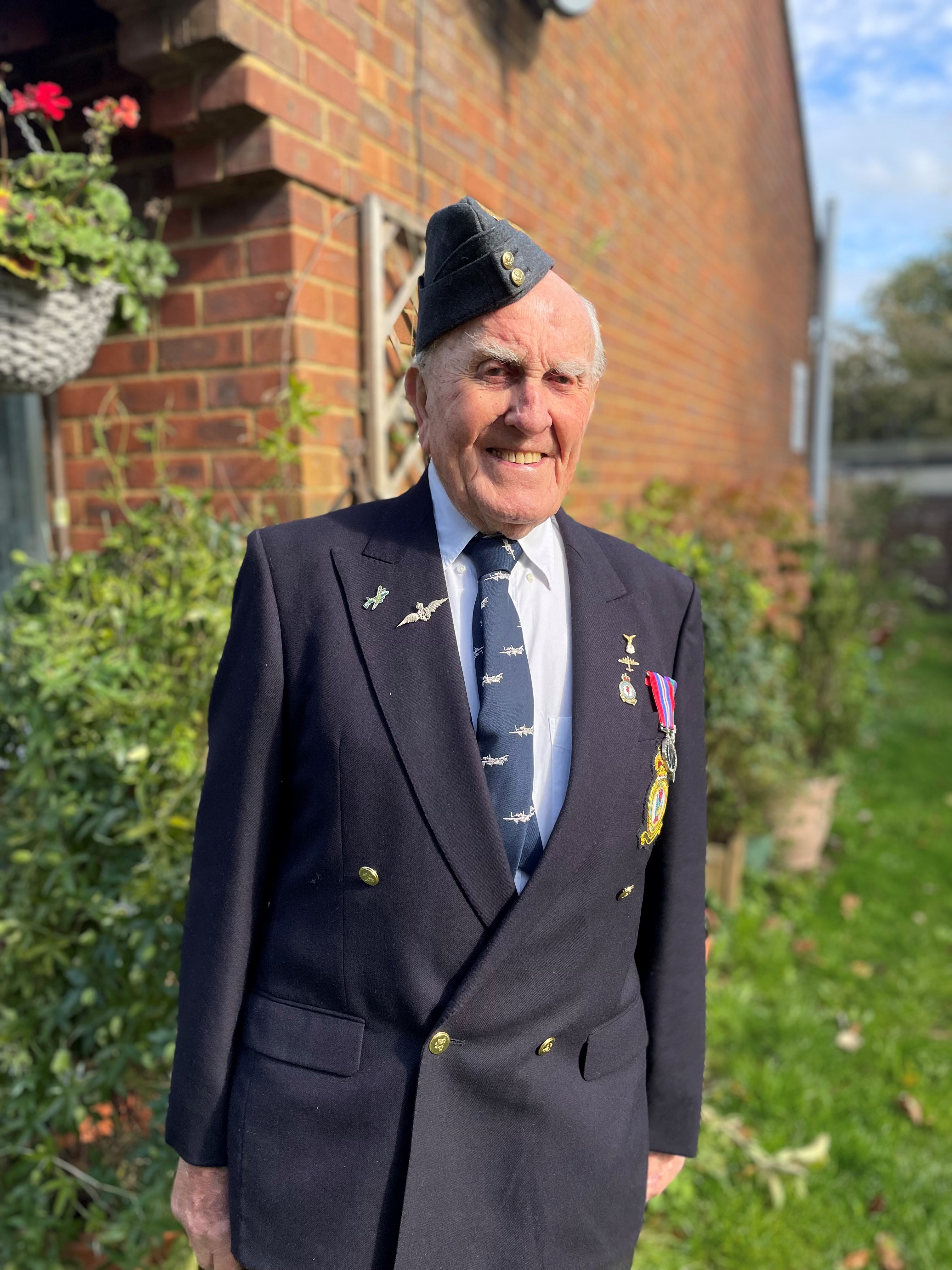 Blind veteran Michael smiling in uniform 