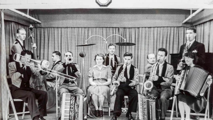 Photo of Gwen performing onstage with a band